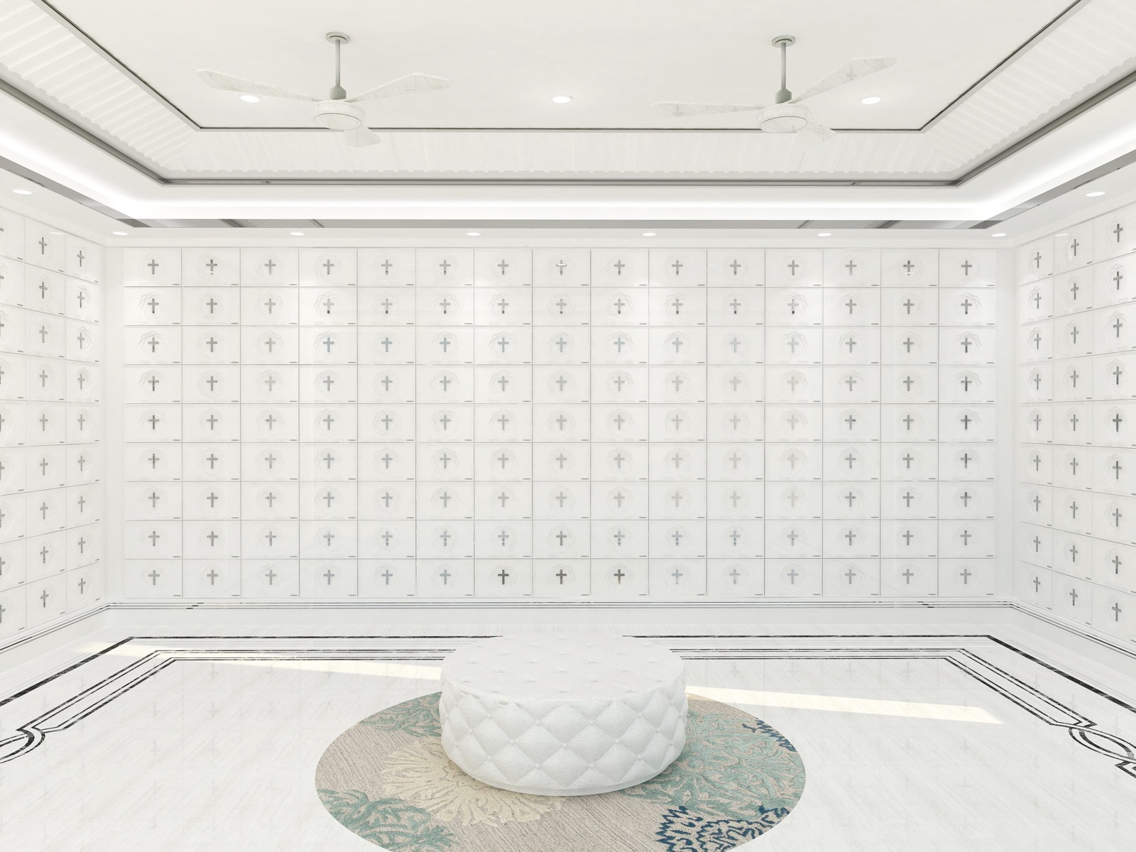 Bright white Christian columbarium with cross-marked niches and a central visitor seat