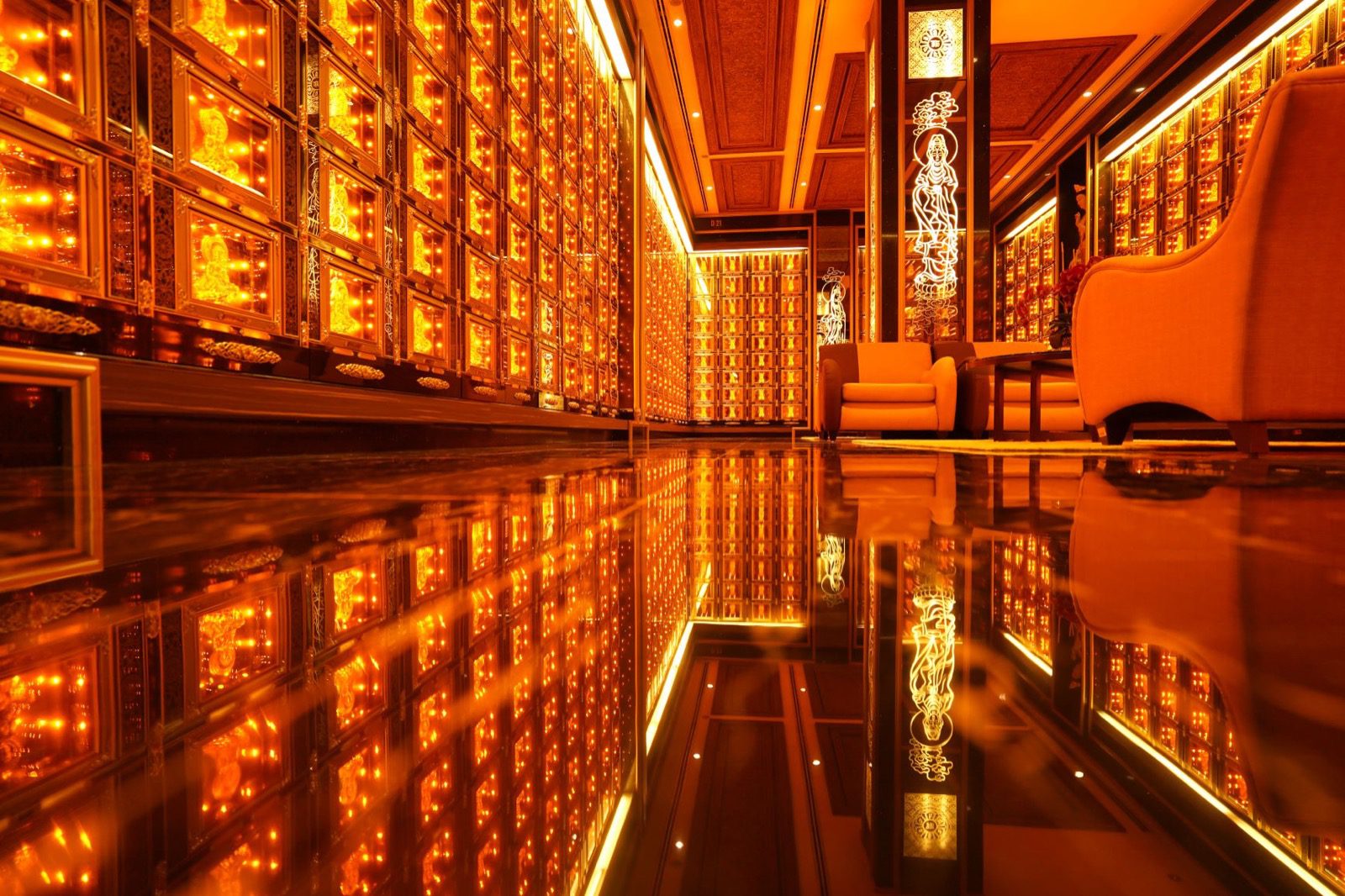 Luxuriously appointed columbarium hall with illuminated Buddhist memorial niches