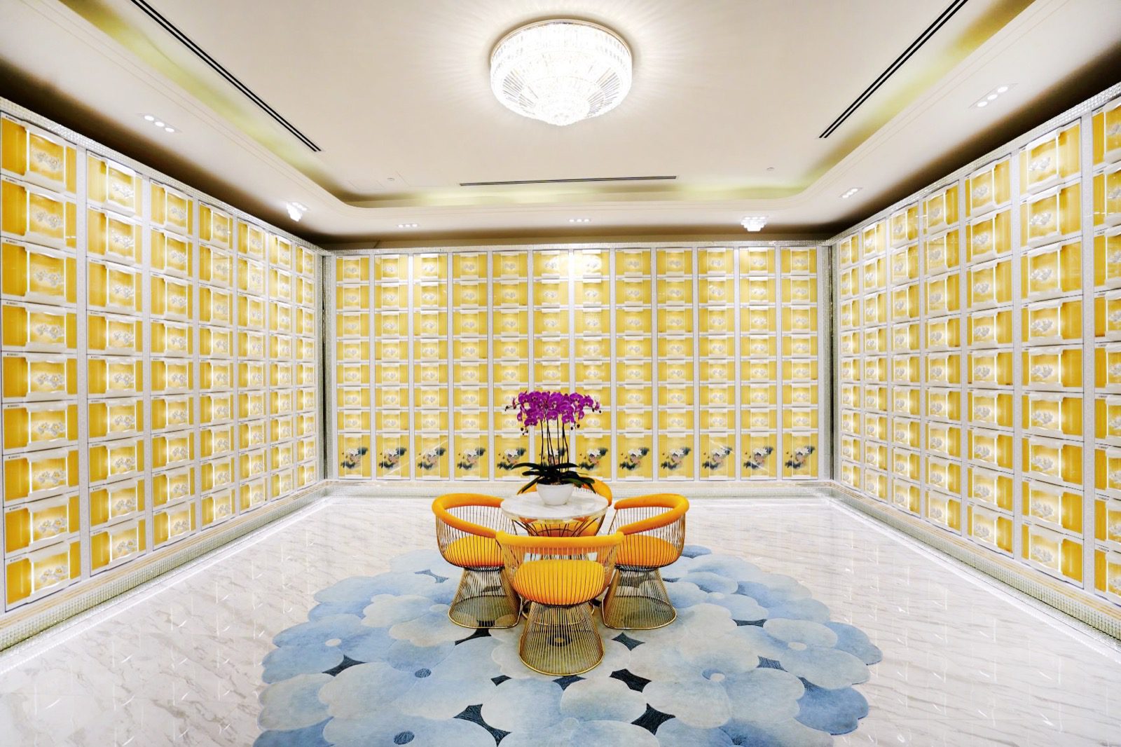 Bright modern columbarium with contemporary niche panels and a visitor seating area